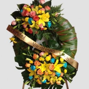 Corona funeral de dos medallones con flores mixtas
